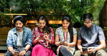 Teenagers Splitting Expenses on Phone